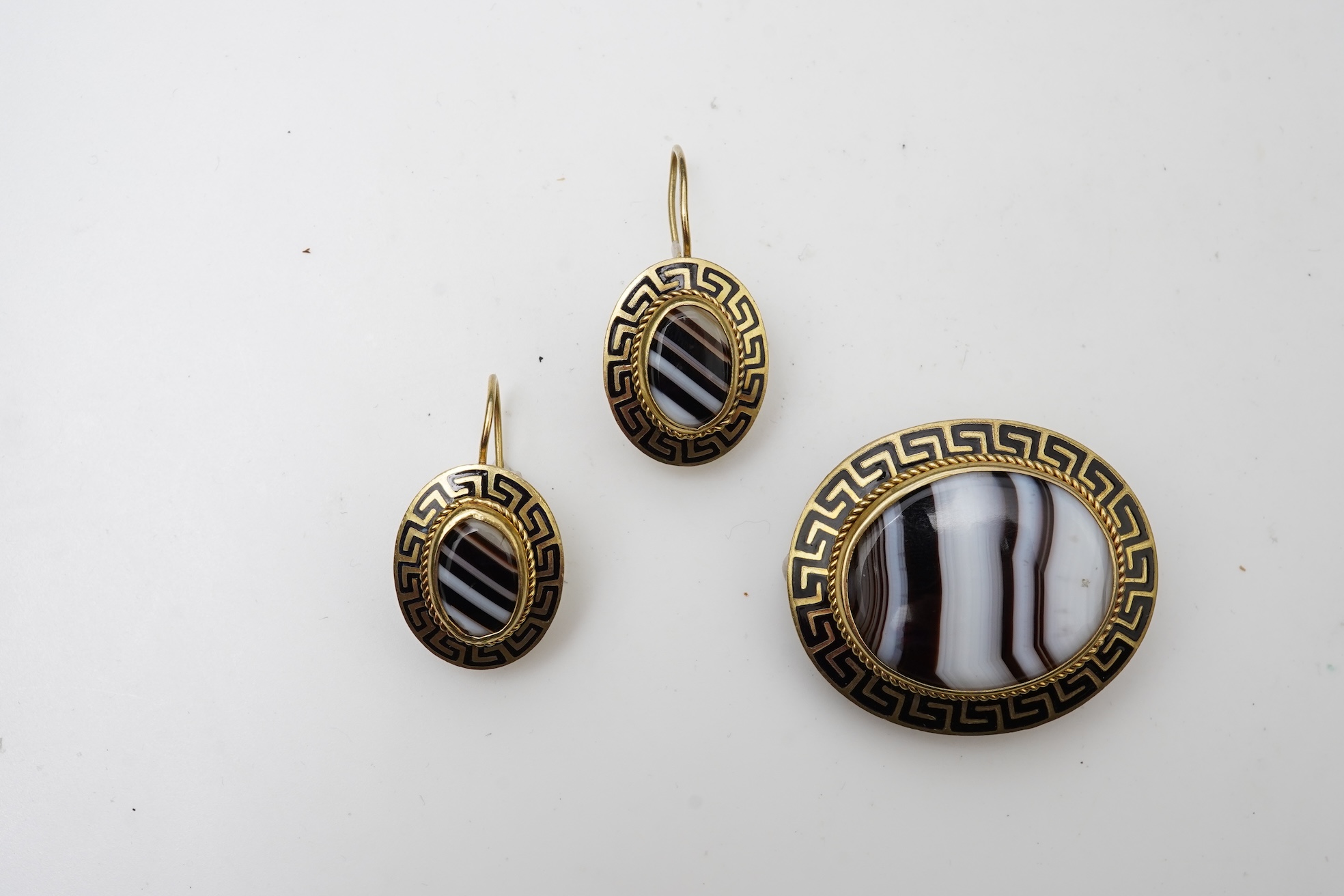 An enamel and onyx demi-parure, late 19th century